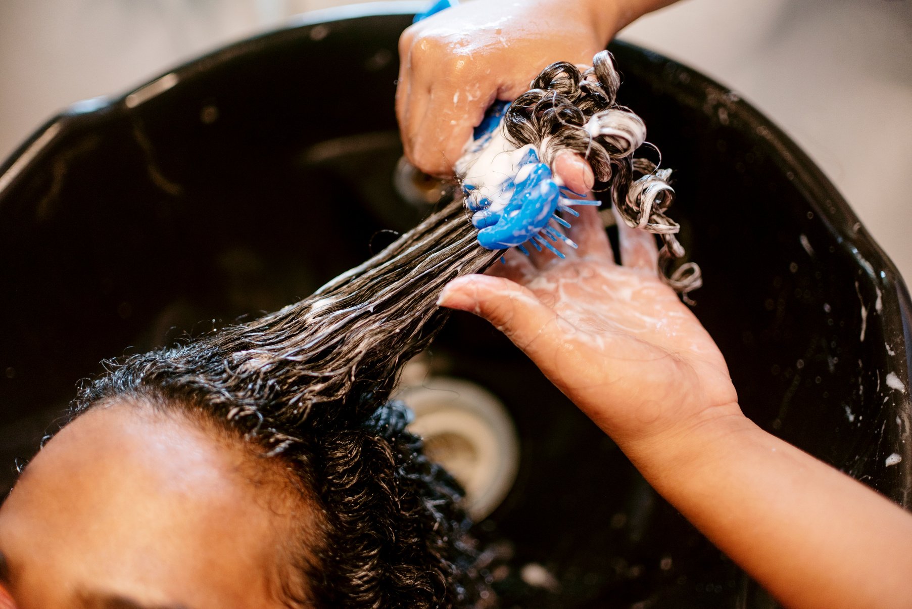 Queer Man Getting His Hair Washed and Treatment